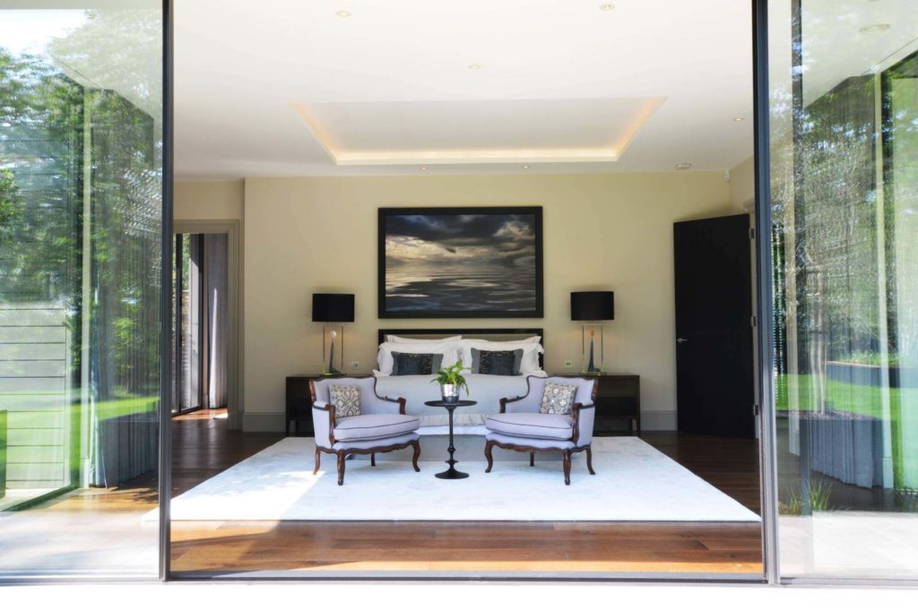 Ultraline black sliding doors modern new build