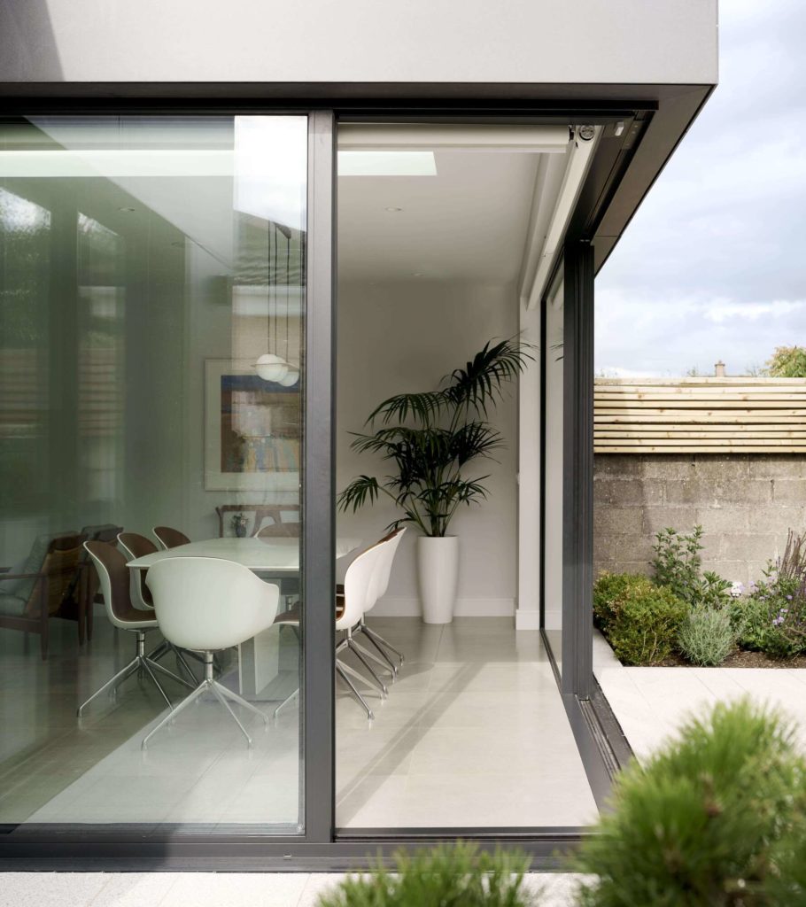 Ultraline 2 panel sliding door with opening corner in modern zinc clad extension