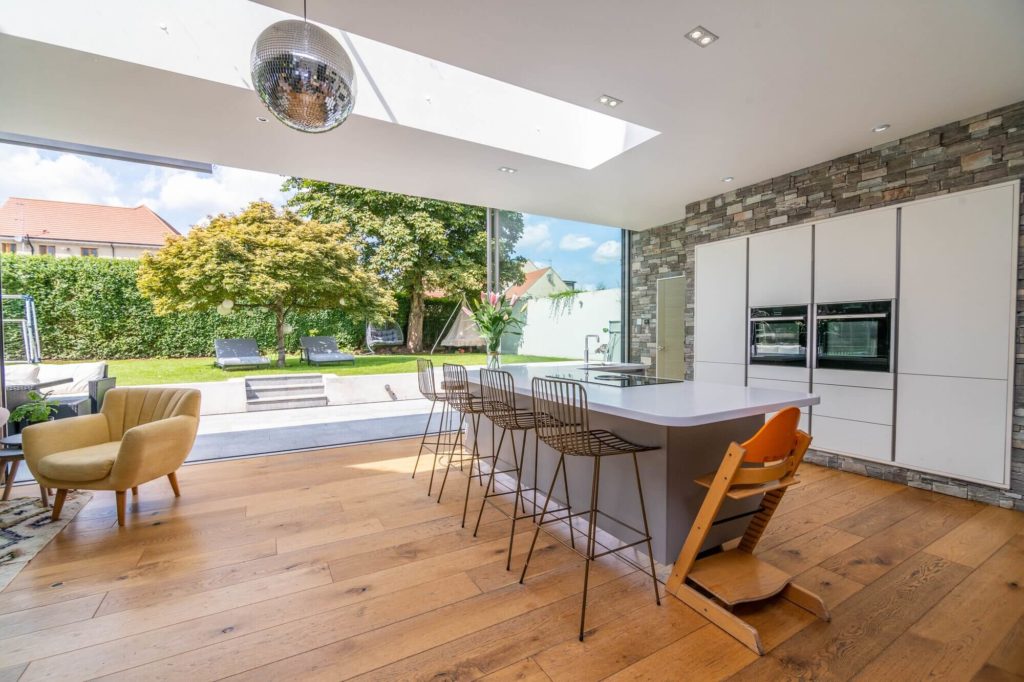 Traditional property with award winning Ultraline sliding doors in modern extension