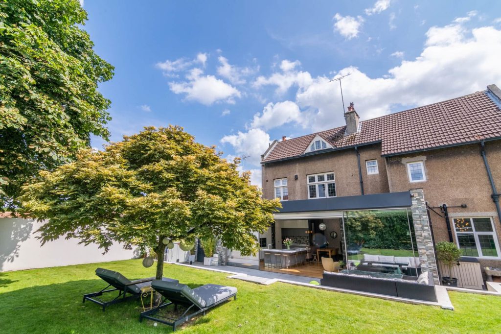 Traditional property with award winning Ultraline sliding doors in modern extension