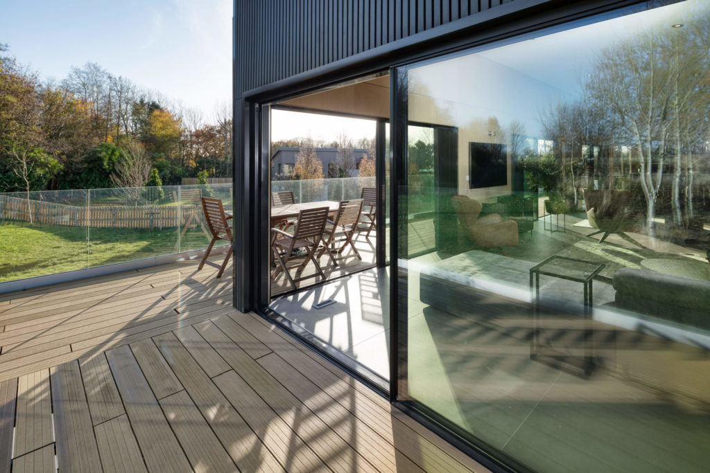 Black ultraline sliding doors with black cladding new build