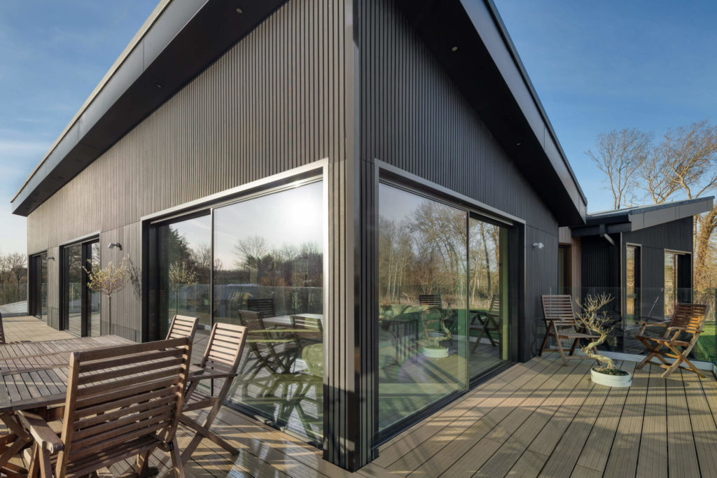 Black ultraline sliding doors with black cladding new build