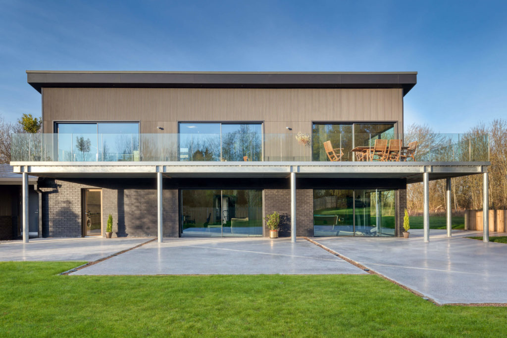 Black ultraline sliding doors with black cladding new build