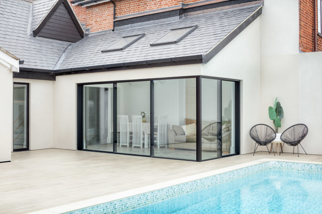 Ultraline opening corner sliding doors pool house installation