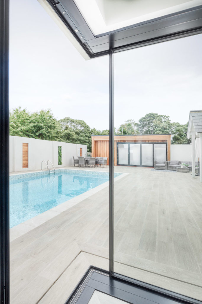 Ultraline opening corner sliding doors pool house installation