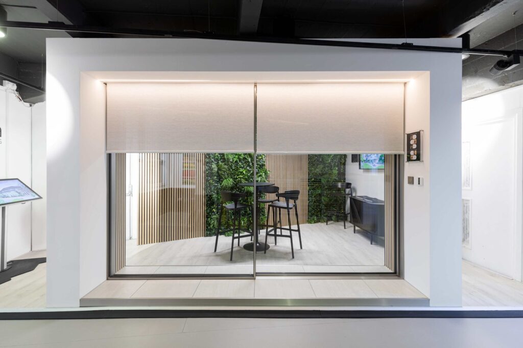 Minima sliding doors london showroom showing concealed roller blinds next to sliding doors