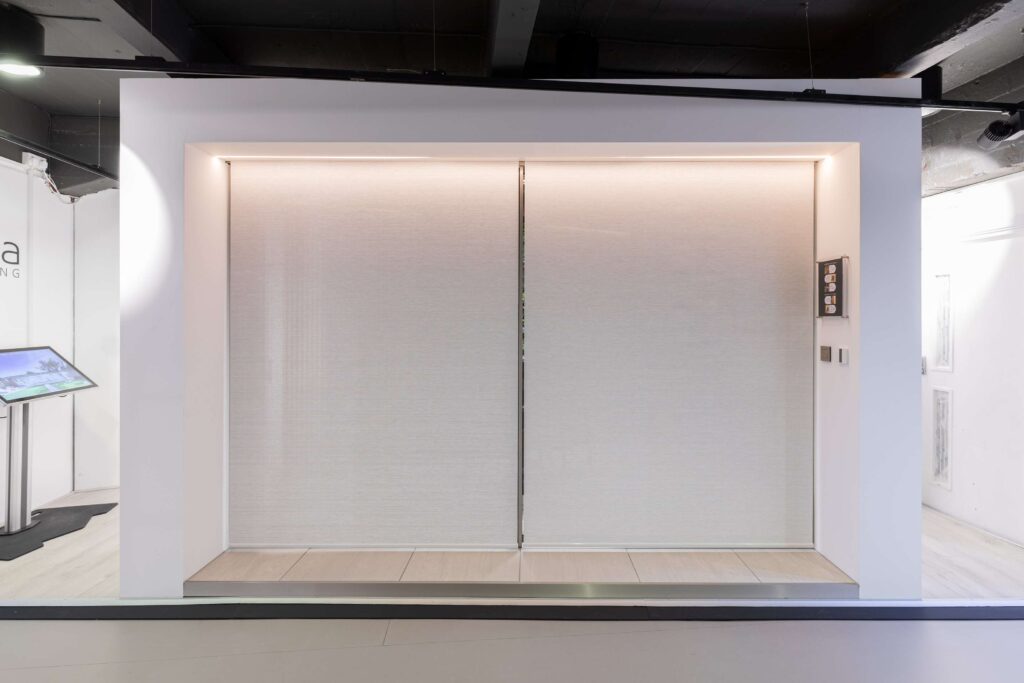 Minima sliding doors london showroom showing concealed roller blinds next to sliding doors