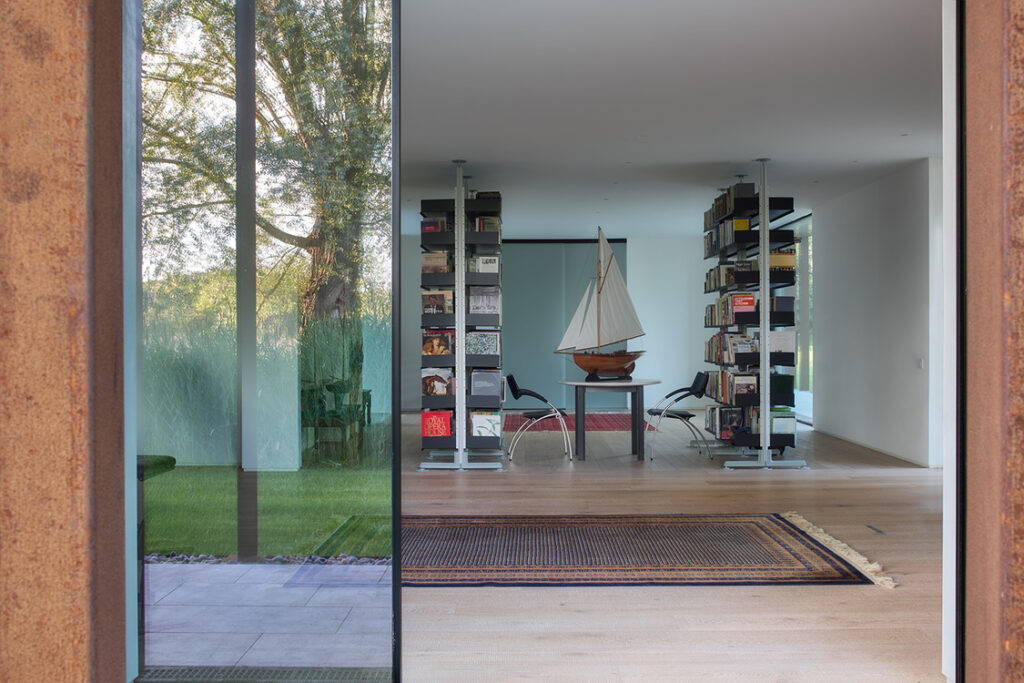 Modern interior with bookshelf and model sailboat